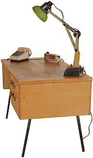 Desk with lamp, telephone, radio